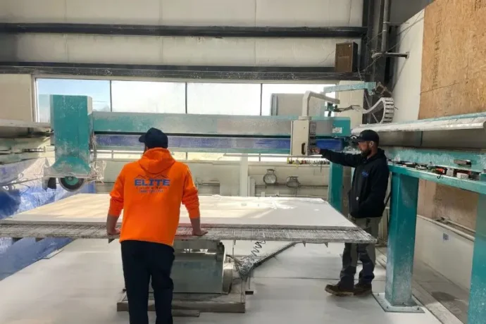 Owners of Elite Granite and Marble working on a remolding project